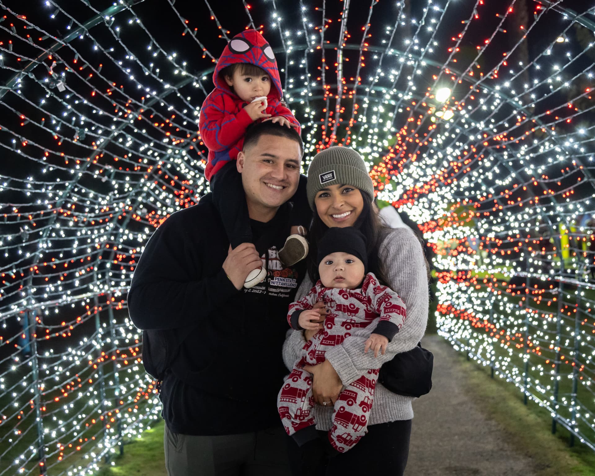 Family with young children in the SnowSide light tunnel